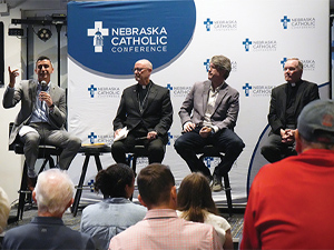 Bishop, panel address AI and human dignity at discussion for crowd at Lincoln pub